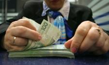 Miliardy na „sprzątanie” po upadłych bankach, zero na gwarancje depozytów. Giełdowe spółki pokazały, ile zapłacą